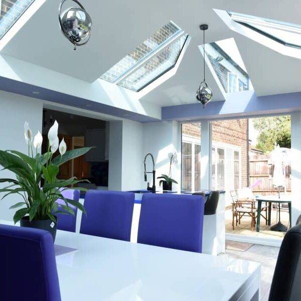 Modern interior of a modular home with skylights and garden view in Poole & Bournemouth.