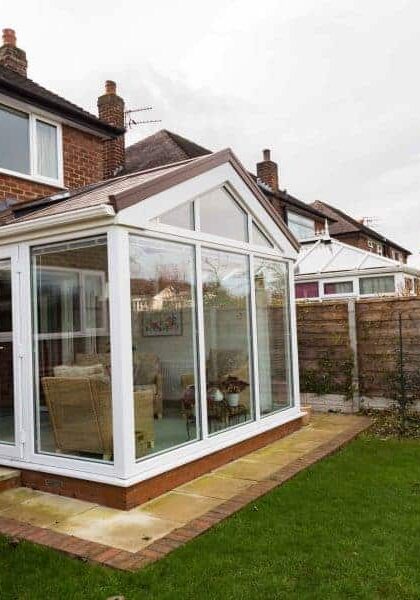 Modern white conservatory extension in Poole & Bournemouth garden.
